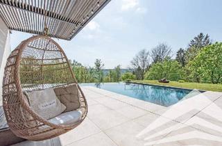Villen zu kaufen in 4048 Puchenau, Stadtnahe High-End Villa mit unverbaubarem Naturblick & Infinity-Pool!