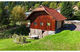 Grundstück zu kaufen in 9552 Steindorf am Ossiacher See, Großzügiges Baugrundstück mit charmantem Holzgebäude – Ihre Chance für individuelle Wohnträume in Steindorf am Ossiacher See